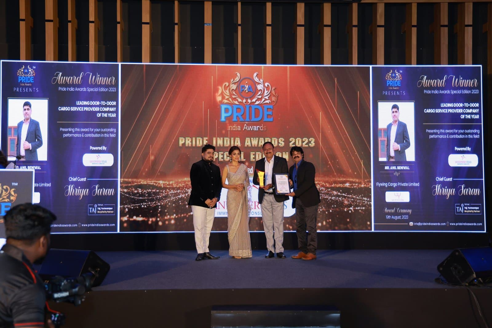 Flywing Cargo receiving the Pride India Award 2023 on stage
