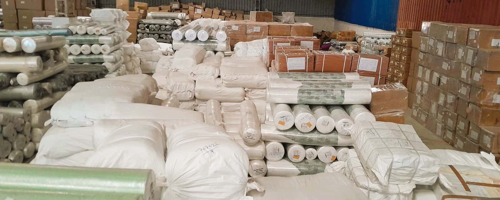 Warehouse racking stacked with cartons